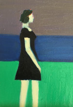 A woman in a black dress standing on the seashore