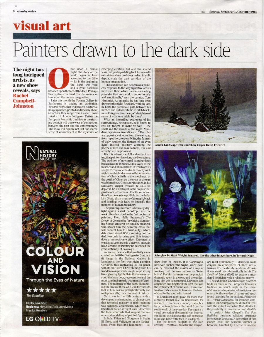 newspaper spread with review of art.