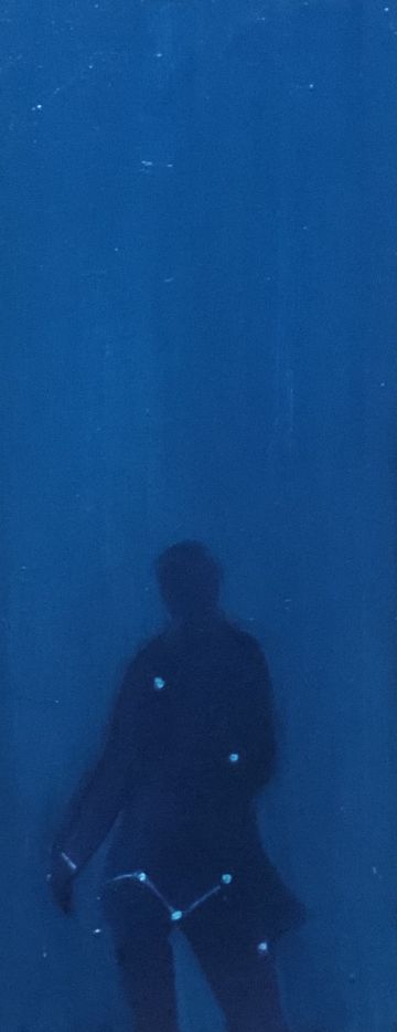 Silhouette of a blue figure..