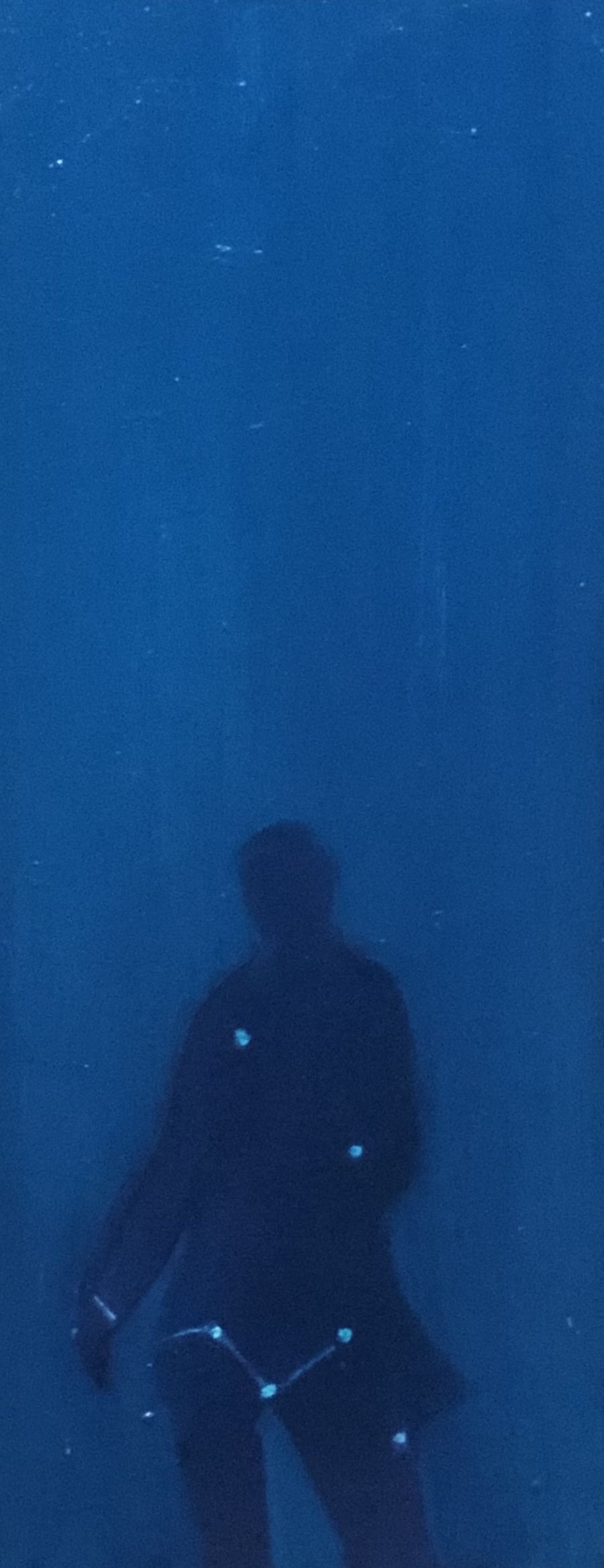 Silhouette of a blue figure..