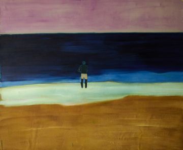 A male figure standing and looking out over the seashore..