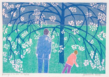 Man and boy under blossom tree.