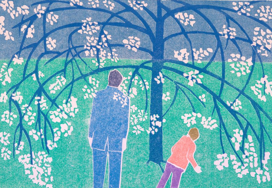Man and boy under blossom tree.