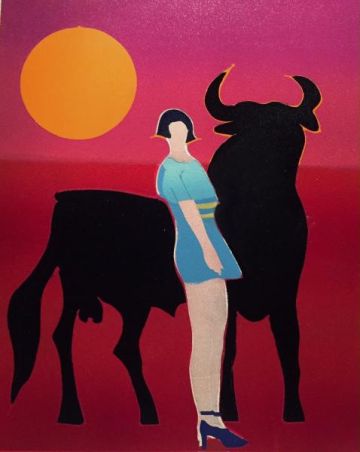 Carmen standing in front of a bull.
