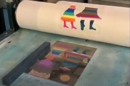 Colourful inked figures on a printing roller