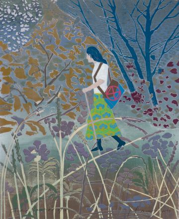 Woman walking in the forest.