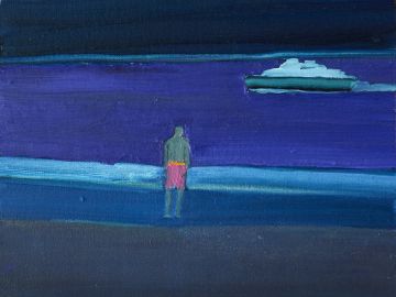 Male figure standing by the seashore looking out at a boat..