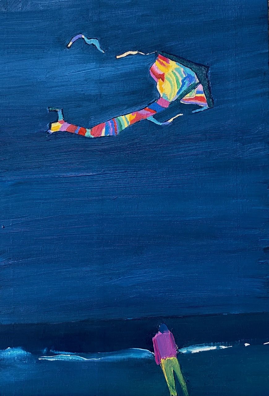 A figure looking out over the shore and a multi-coloured kite flying in the sky..