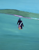 A figure standing in a blue sea looking towards land
